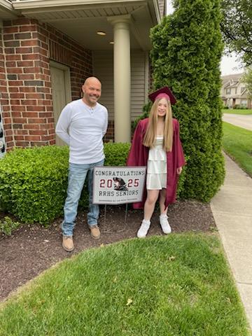 Makayla and Matt in front of sign